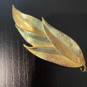 Carolee gold tone leaf brooch.